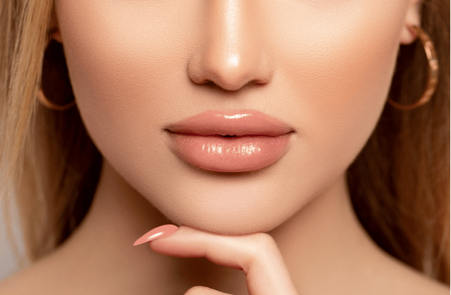 Close up sexy lips in nude lipstick. Close up sexy lips in nude lipstick.
