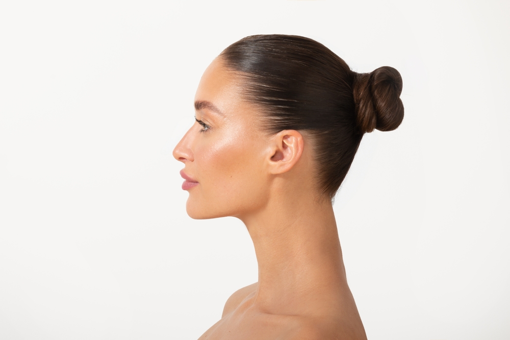 Profile view of woman with proportional nose after rhinoplasty.