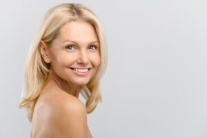 Attractive woman in her 50s has a rejuvenated face after facelift