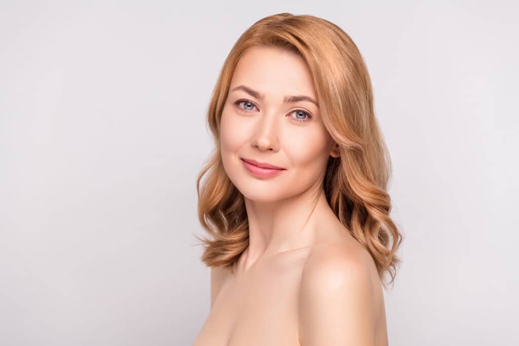 Woman has beautiful, smooth skin after aesthetic treatments.